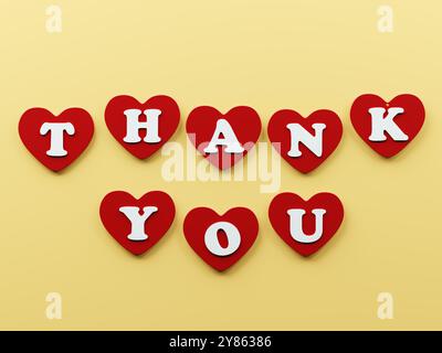 Red heart shapes arranged in two rows, with white letter spelling out THANK YOU on a soft yellow background Stock Photo