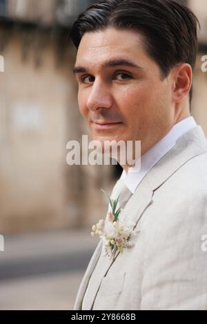 Groom looking confidently at camera before entering wedding ceremony, Alicante, Spain Stock Photo