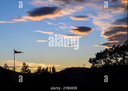 Fluffy clouds in the evening sky over the Kragerø archipelago in Telemark county, Norway. Stock Photo