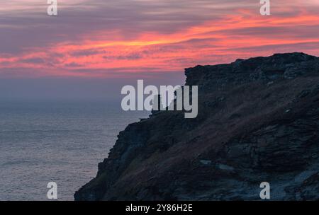 Cornish coast and the cliffs at Tintagel Castle island by beautiful sunset Stock Photo