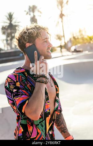 stylish millennial guy using mobile phone Stock Photo
