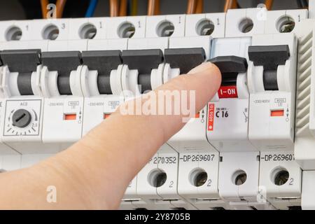 Testing circuits with probes in an electrical panel Stock Photo