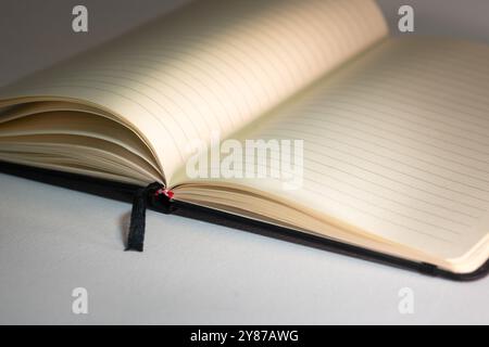 Blank lined notebook. Side view on light background. Eco paper. Stock Photo