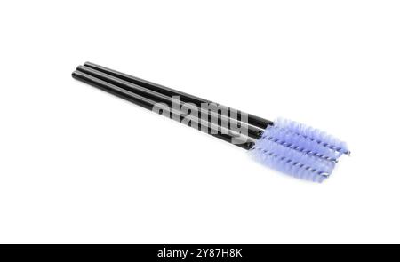 Many disposable makeup brushes isolated on white Stock Photo