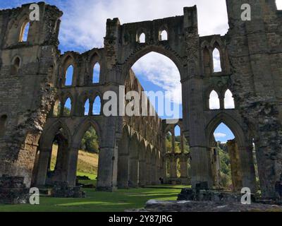 Rievaulx. near Helmsley, North Yorkshire, England, United Kingdom - September 28. 2024: Visitors at Rievaulx Abbey in a sunny day in early autumn. Fou Stock Photo