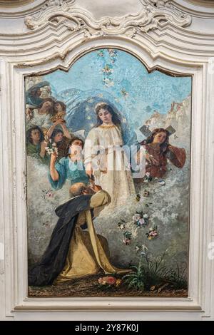 Church of San Francesco, canvas by local painter Paolo De Cecco depicting the Madonna del Rosario and San Domenico. Città Sant'Angelo, Abruzzo Stock Photo