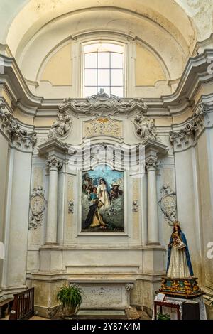 Church of San Francesco, canvas by local painter Paolo De Cecco depicting the Madonna del Rosario and San Domenico. Città Sant'Angelo, Abruzzo Stock Photo