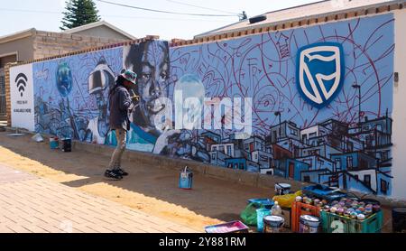 Johannesburg, South Africa - September 08, 2022: Artist creates graffiti Orlando West, Soweto, Johannesburg, South Africa Stock Photo