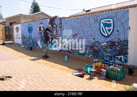 Johannesburg, South Africa - September 08, 2022: Artist creates graffiti Orlando West, Soweto, Johannesburg, South Africa Stock Photo