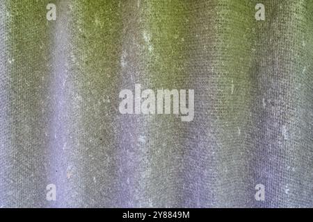 Texture of green fibrous fabric with white scuffs. Stock Photo