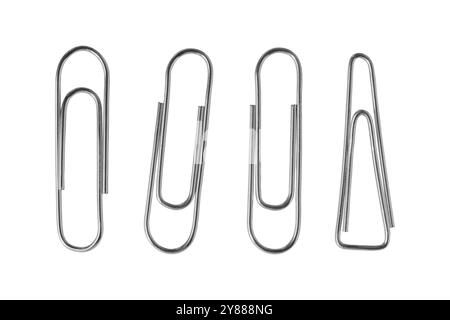 A collection of various paper clips arranged on a clean surface showcasing different shapes and sizes in an organized manner. Isolated Stock Photo