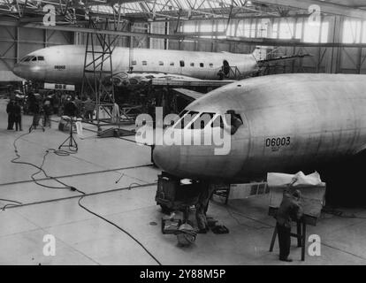 More 'Comets' - The World's ***** Airliners - Under ***** -- Work on the streamlined nose of one of the Comets, while, in the background, another Comet under construction.***** the success of the world's first ***** , the De Havilland 'Comet', which has two ***** flights to its name, others are now ***** construction at the De Havilland factory here.The second ***** expected to fly in the late summer of this year.The first two to come off the assembly line have been ordered by the Ministry of Supply on an ordinary commercial basis. March 30, 1950. Stock Photo