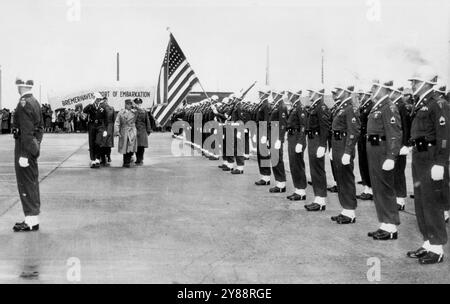 Reinforcements for Europe -- Gen. Alphonse Juin (right in reviewing group) salutes American flag as he inspects troops of the fourth infantry division after their arrival in western Allies. General Juin, French commander of the  Allied ground forces in central Europe, uses his left hand to salute because of an army injury he received to his right arm in world war I. May 29, 1951. (Photo by AP Wirephoto). Stock Photo