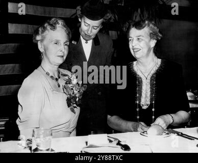 Princess Alice Attends Girl Scout Banquet -- Princess Alice, wife of the Governor General of Canada, the Earl of Athlone, in Washington for two-day visit, attends Girl Scout 33rd birthday banquet here tonight with Mrs. Franklin D. Roosevelt (right). Mrs. J. Harris Franklin (center), Girl Scout Commissioner for the District of Columbia, leans forward to address them. March 22, 1945. (Photo by AP Wirephoto) Stock Photo