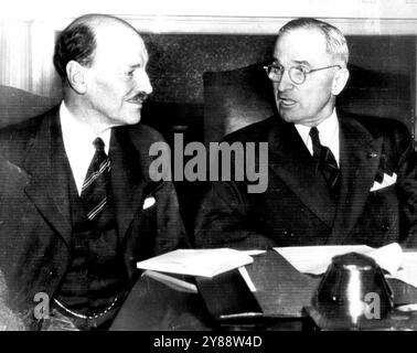 As Truman And Attlee Met Before -- Britain's Prime Minister Clement Attlee, who plans to leave London by plane for Washington this week-end to meet with President Truman on the Korean situation, is shown as he conferred with the President in the White House in November, 1945, when they also discussed atomic bomb control. December 01, 1950. (Photo by AP Wirephoto). Stock Photo