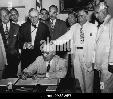 President Truman signs the North Atlantic Treaty with guests in the ...