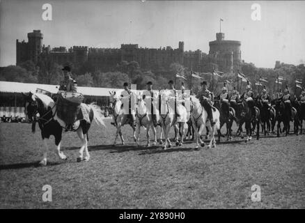 Household Cavalry Bring Pageantry To Royal Windsor Show -- Scene of pageantry in the Home Park, Windsor Castle, to-day, (Thursday) as - with the Castle dominating the background - the Household Cavalry perform their Musical Ride during the Royal Windsor Horse Show.There are contingents of both the Life Guards and the Royal Horse Guards.The three-day Show began to-day. May 11, 1950. (Photo by Reuterphoto). Stock Photo