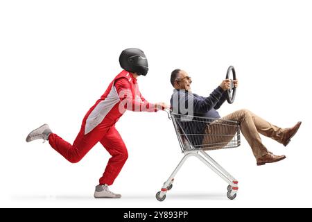 Car racer running and pushing a man inside a shopping cart isolated on white background Stock Photo