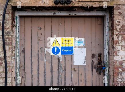 Asbestos warning signs, Bletchley Park campus, Milton Keynes, UK Stock Photo