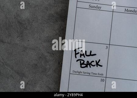Calendar reminder to fall back - or set the clocks back an hour - at the end of Daylight Saving Time on November 3, 2024. Stock Photo