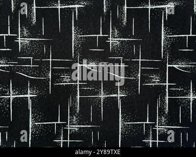 Texture of a random black and white cross pattern, random white sparkles cross and glitters pattern on black nylon fabric. Cloth and fabric seamless Stock Photo