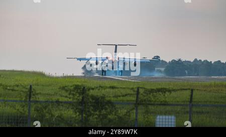 Balikpapan, Indonesia - September 26th, 2024. The presidential jet is touching down on the runway. The plane's tires can be seen making contact with t Stock Photo