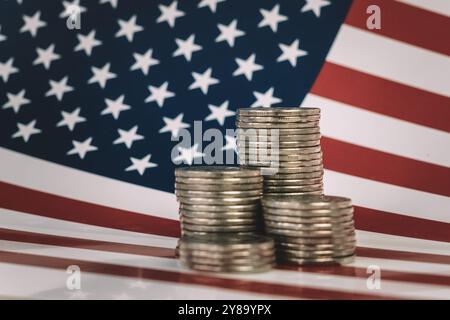 US coins and American flag. stacks of metal money are on the American flag. Financial system city concept. Stock Photo