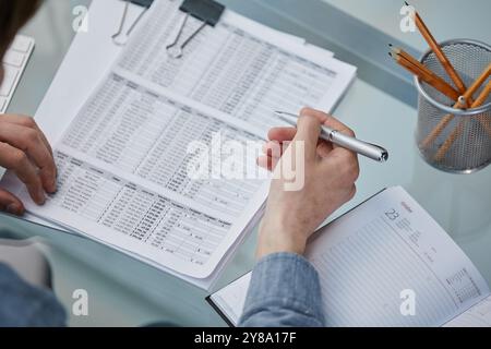 legal expert professional lawyer reading and checking financial documents or insurance contract Stock Photo