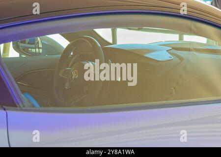 Sunlight reflecting on the dashboard and steering wheel of a maserati mc20 supercar Stock Photo