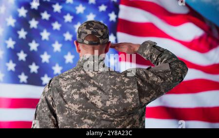 Military US Soldier Saluting Flag. Army Veteran Stock Photo