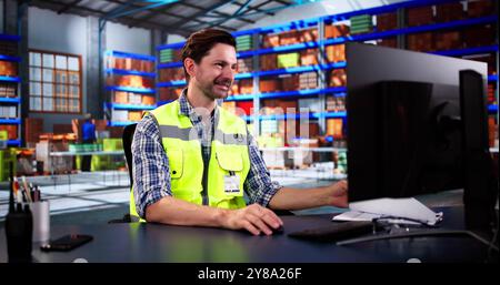 Warehouse Worker And Manager Checking Inventory In Warehouse Stock Photo