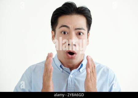 Young Man Looking With Surprised Expression Stock Photo