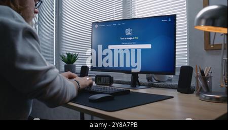 Adult man enters prompt in artificial intelligence chatbot on personal computer. AI image generator app generate detailed high-quality image portrait of ballerina. From text prompt to generated photo. Stock Photo