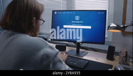 Adult man enters prompt in artificial intelligence chatbot on personal computer. AI image generator app generate detailed high-quality image portrait of ballerina. From text prompt to generated photo. Stock Photo