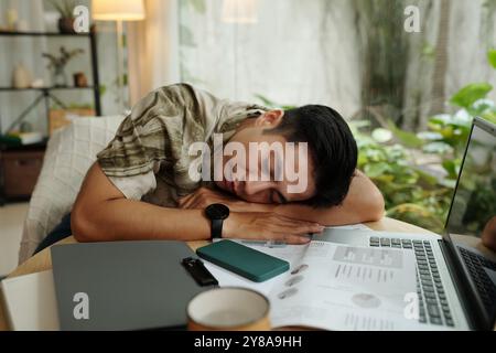 Man Sleeping At His Workplace Stock Photo