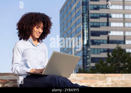 female entrepreneur working remotely on laptop Stock Photo