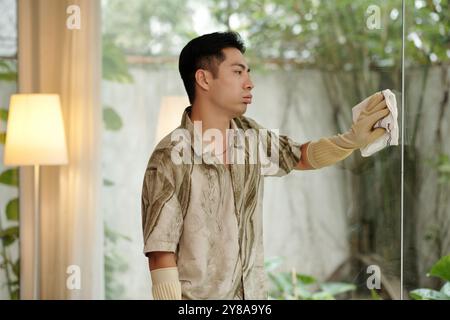 Man Cleaning The Panoramic Window Stock Photo