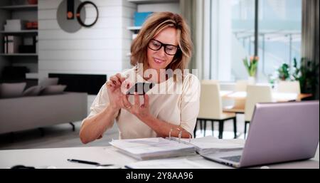 Taking Document Picture Or Photo With Phone. Smartphone Optical Document Stock Photo
