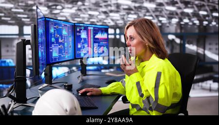 Machine Heating Pipes Control Using Computer. Worker Monitoring Plant Stock Photo