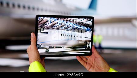 Technician Doing Industrial Inspection Using Tablet Technology Stock Photo