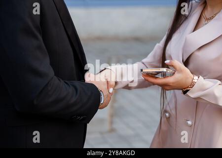 Elegant Business Agreement Between Two Professionals Outdoors. Stock Photo