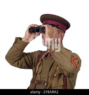 The commander of the Red Army looks through binoculars. Isolated on white Stock Photo