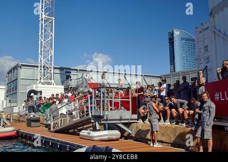 PPL PHOTO AGENCY - COPYRIGHT RESERVED 2024 America's Cup - Barcelona, Spain Final Round Robin LVC race 11: Luna Rossa supporters and families at the dock of the base waiting the return of the lady  PHOTO CREDIT: © Alexander Panzeri/PPL Stock Photo