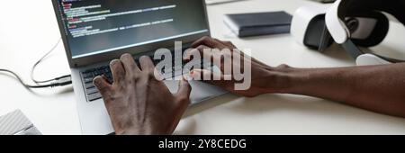 Website banner of unrecognizable man typing on laptops keyboard Stock Photo