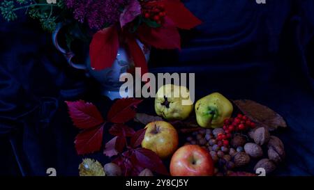 A vase with flowers- Apples, walnuts. quinces, hazelnuts. Stock Photo