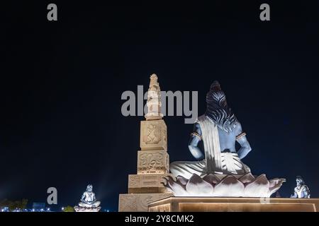 idols of hindu holy sage sitting in mediation at outdoor at night Stock Photo