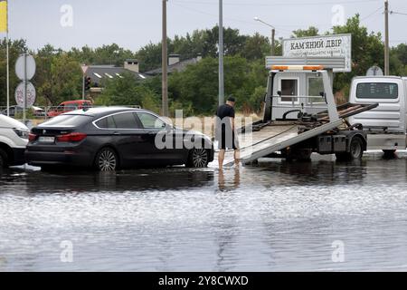 ODESSA, UKRAINE-September 5,2024: After heavy rains, traffic jams formed on roads, cars are doused with water and stall. Cars float in puddles on the Stock Photo