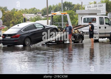 ODESSA, UKRAINE-September 5,2024: After heavy rains, traffic jams formed on roads, cars are doused with water and stall. Cars float in puddles on the Stock Photo