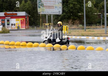 ODESSA, UKRAINE-September 5,2024: After heavy rains, traffic jams formed on roads, cars are doused with water and stall. Cars float in puddles on the Stock Photo