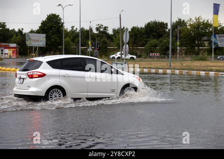 ODESSA, UKRAINE-September 5,2024: After heavy rains, traffic jams formed on roads, cars are doused with water and stall. Cars float in puddles on the Stock Photo